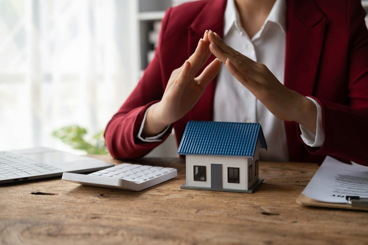 property-insurance-and-security-concept-protecting-gesture-of-man-and-symbol-of-house-